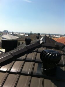 Double whirly birds on roof
